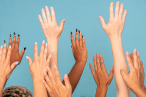 group of women raising hands